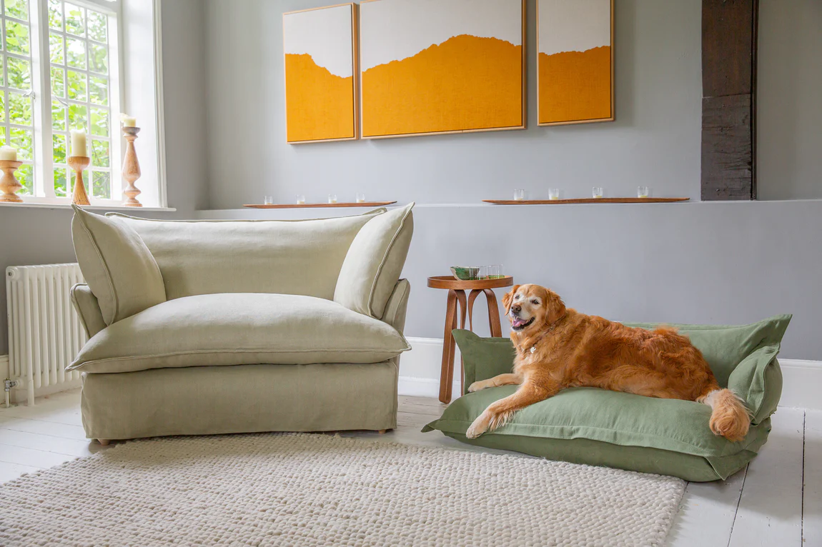 Rosie the Golden Retriever on a large dog bed in Malachite green linen by Maker and Son.