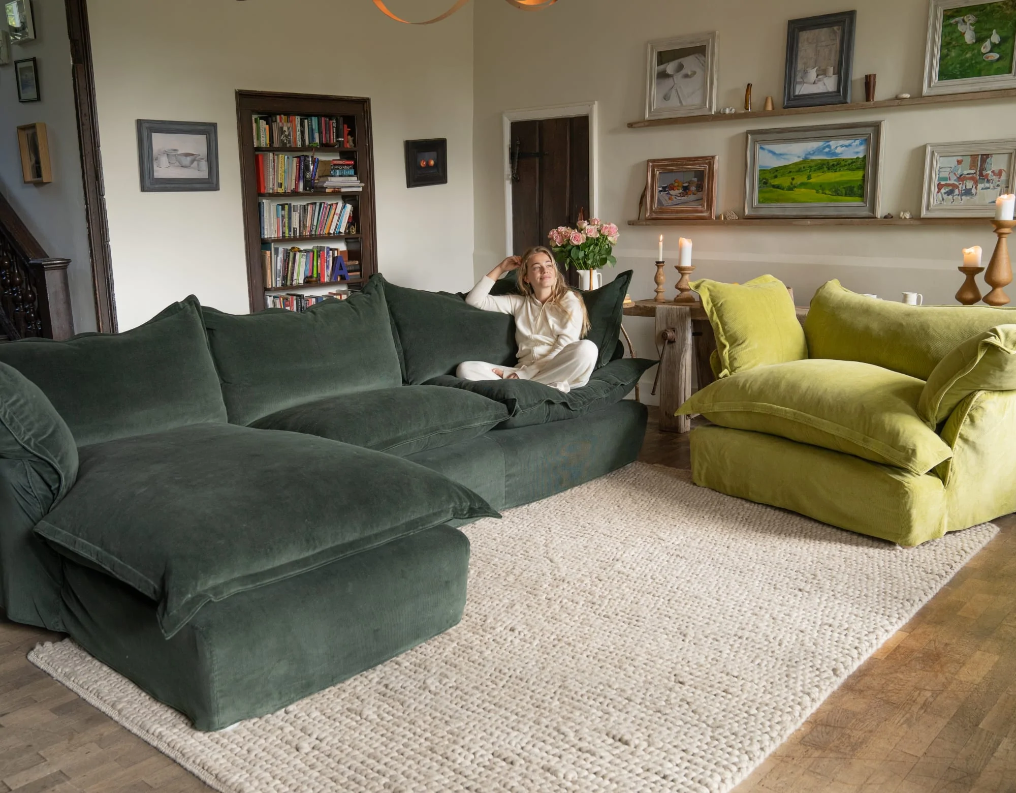 Marnie on a Pine green corduroy, Song pillow edge large Sofa Chaise in a living room setting.